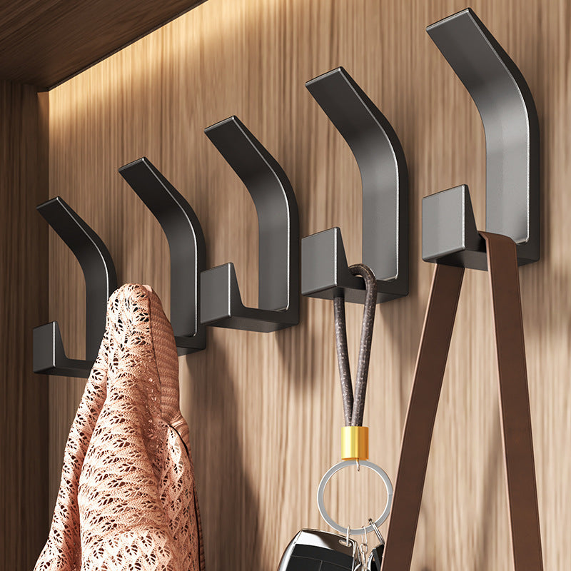 5-piece set of no-drill sticky wall hooks for versatile storage of clothes and hats in bedroom, kitchen, and bathroom.