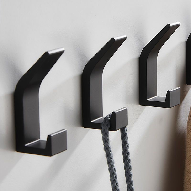 5-piece set of no-drill sticky wall hooks for versatile storage of clothes and hats in bedroom, kitchen, and bathroom.