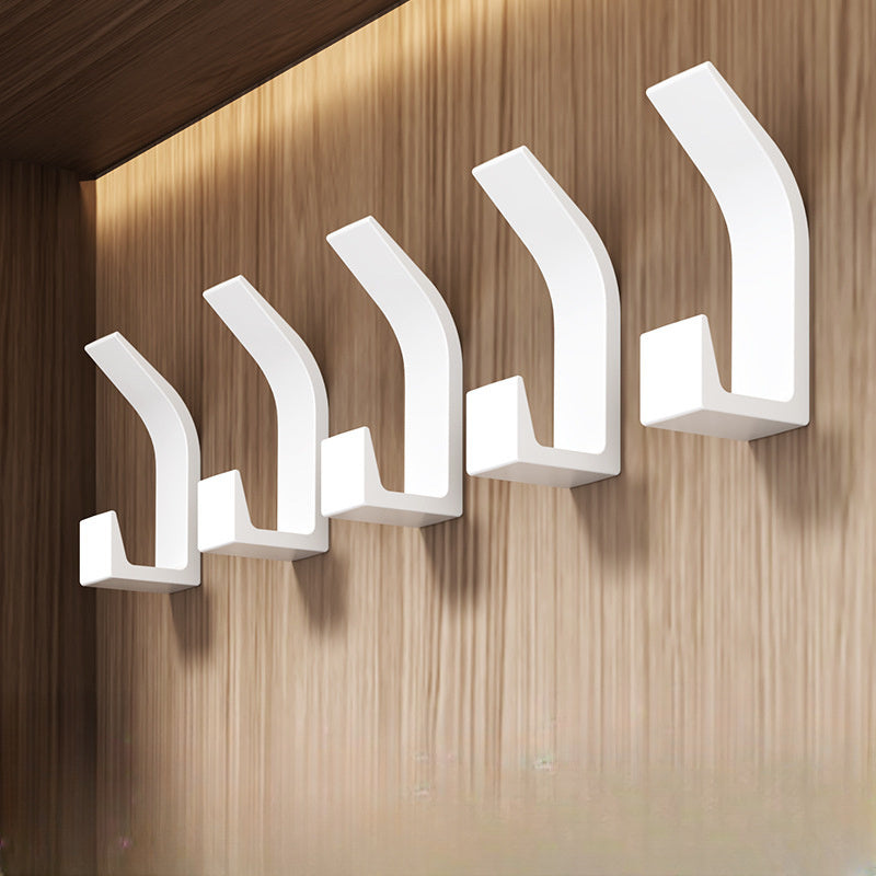 5-piece set of no-drill sticky wall hooks for versatile storage of clothes and hats in bedroom, kitchen, and bathroom.