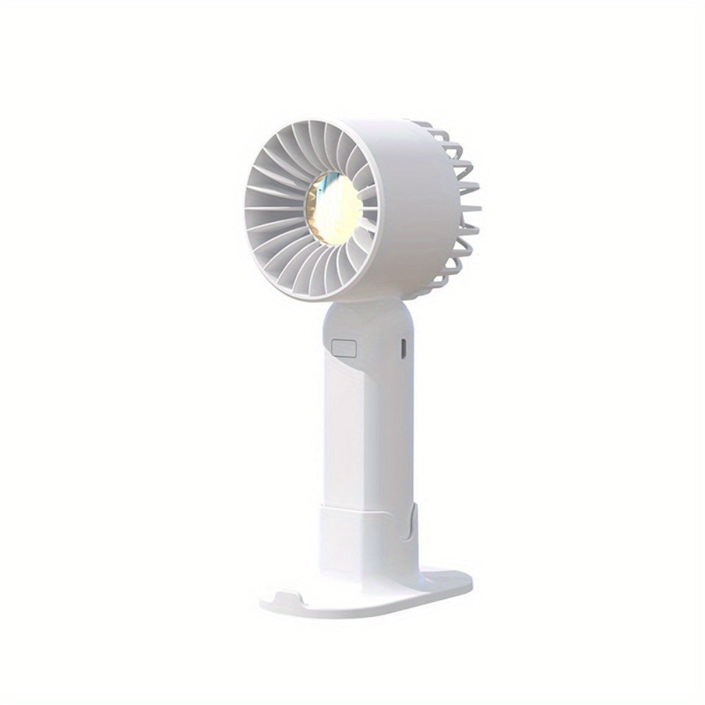 Mini fan with multiple functions - serves as a base and mobile phone holder, features three adjustable wind speeds and can be charged via USB. Perfect for use in the office, outdoors, or while traveling. Handheld and portable design.