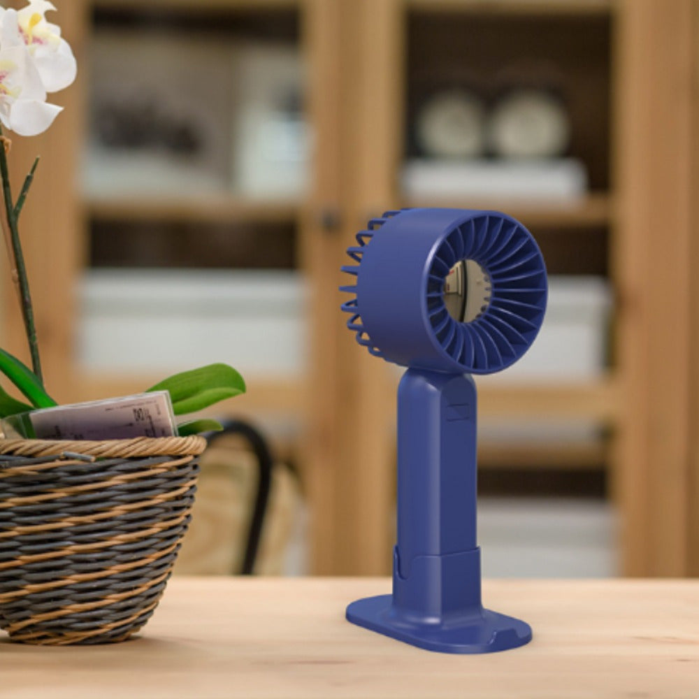 Mini fan with multiple functions - serves as a base and mobile phone holder, features three adjustable wind speeds and can be charged via USB. Perfect for use in the office, outdoors, or while traveling. Handheld and portable design.