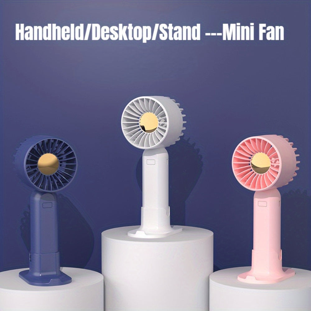 Mini fan with multiple functions - serves as a base and mobile phone holder, features three adjustable wind speeds and can be charged via USB. Perfect for use in the office, outdoors, or while traveling. Handheld and portable design.