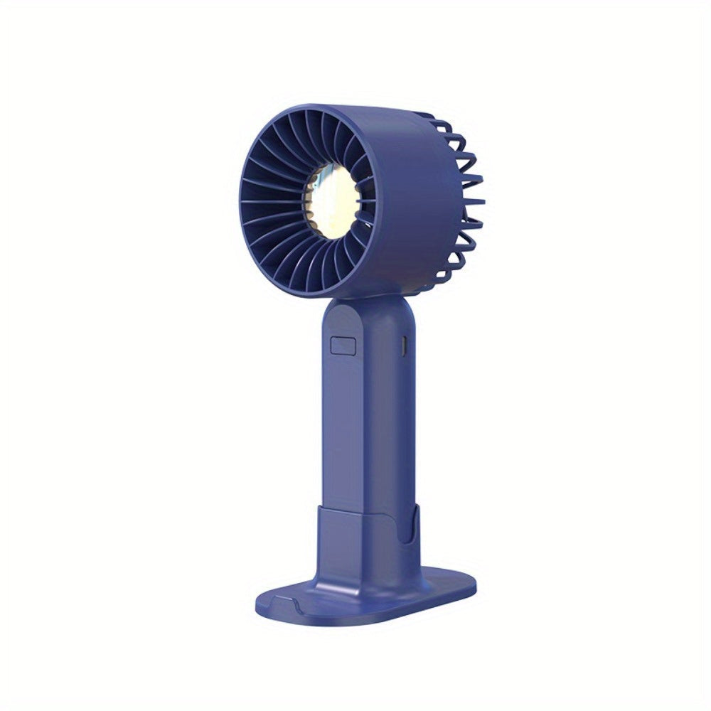 Mini fan with multiple functions - serves as a base and mobile phone holder, features three adjustable wind speeds and can be charged via USB. Perfect for use in the office, outdoors, or while traveling. Handheld and portable design.