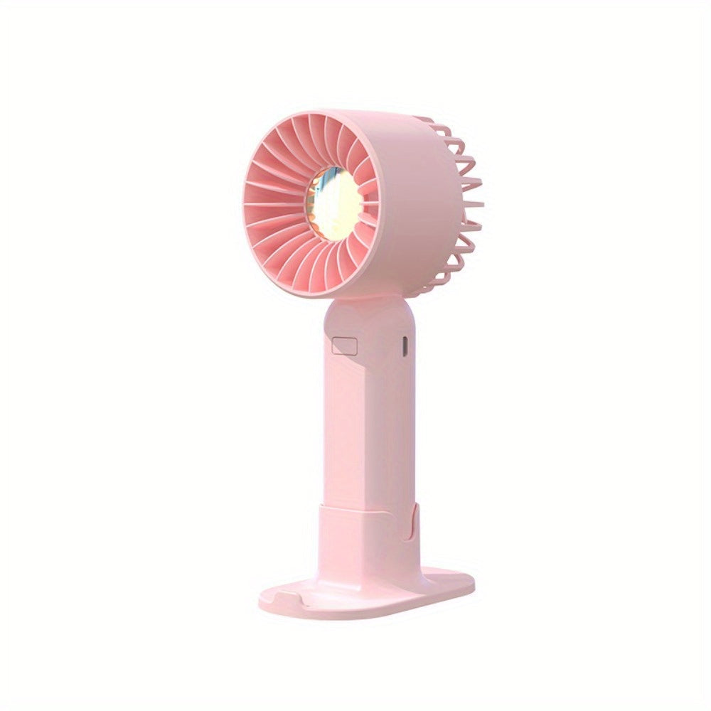 Mini fan with multiple functions - serves as a base and mobile phone holder, features three adjustable wind speeds and can be charged via USB. Perfect for use in the office, outdoors, or while traveling. Handheld and portable design.