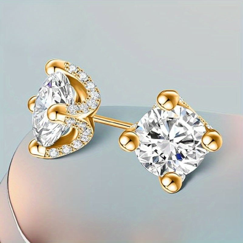 These European and American Fashion Sterling Silver Stud Earrings feature two 1 Carat Moissanite stones set in four claws. They showcase a creative personality with a gorgeous, mature, and luxurious design. These earrings are versatile, perfect for daily