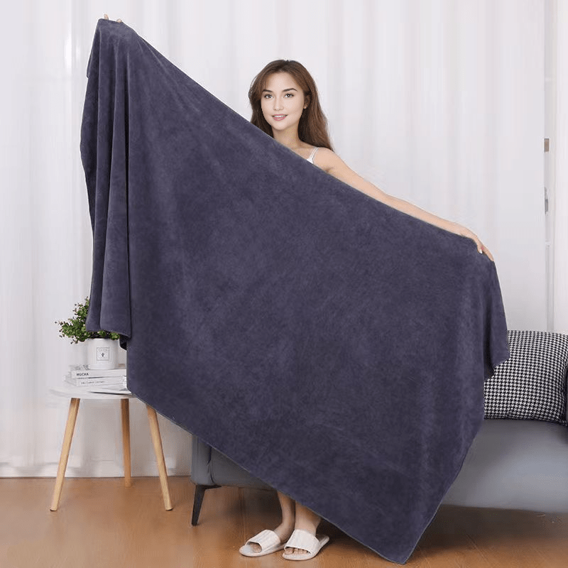 Large, lightweight bath sheet measuring 119.38cm x 200.66cm. Ultra-soft, quick-dry nylon/polyester blend with striped design and modern style, ideal for home use.