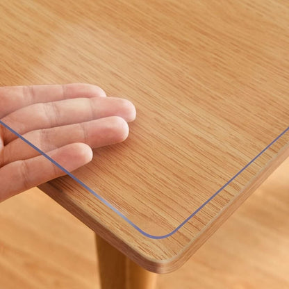 Handmade 1.0mm thick clear PVC tablecloth protector with scratch and heat resistance for home, hotel and coffee tables.