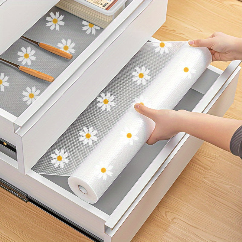 Waterproof Non-Slip Shelf Liner Roll - Plastic, featuring a Daisy Pattern. This Dustproof Drawer Mat is designed for use in Kitchen Cabinets, Refrigerators, and as a Table Pad. It is Moisture-Proof and perfect for use as a Household Liner.