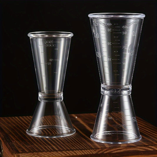 2 double-headed bar measuring cups for accurate cocktail mixing at home or professionally, made of clear plastic.