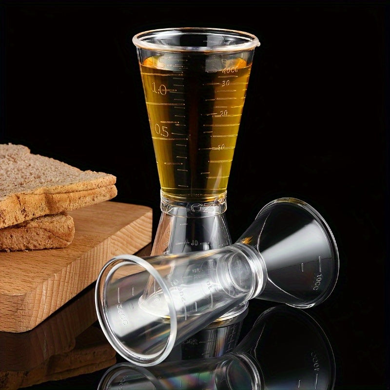 2 double-headed bar measuring cups for accurate cocktail mixing at home or professionally, made of clear plastic.