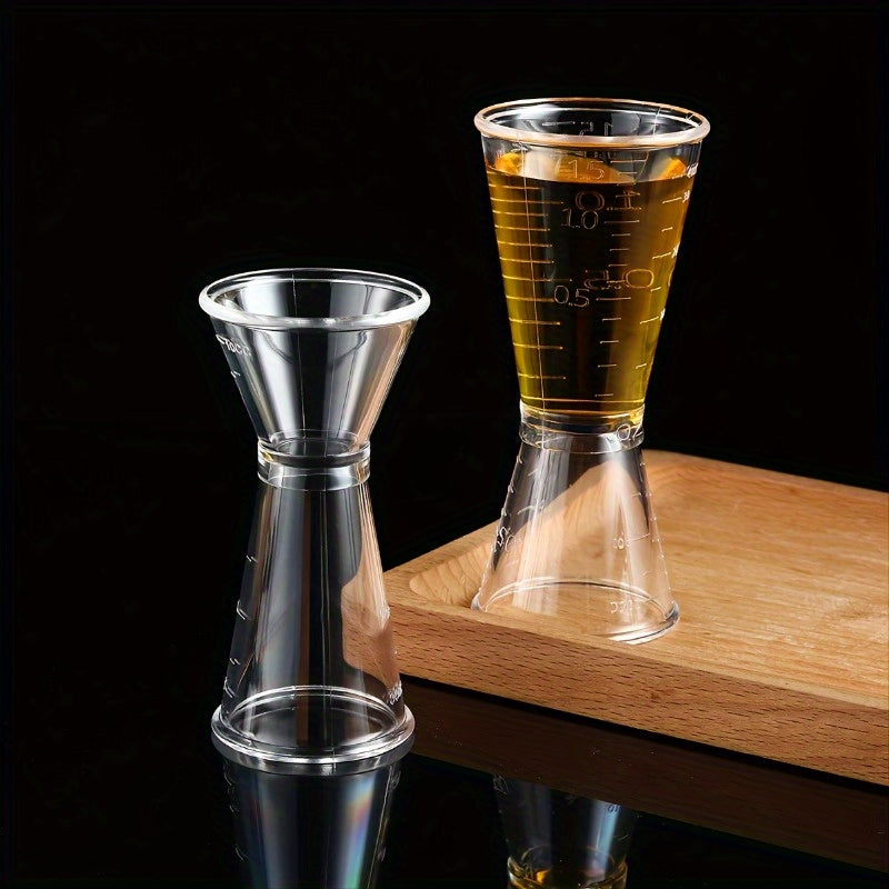 2 double-headed bar measuring cups for accurate cocktail mixing at home or professionally, made of clear plastic.