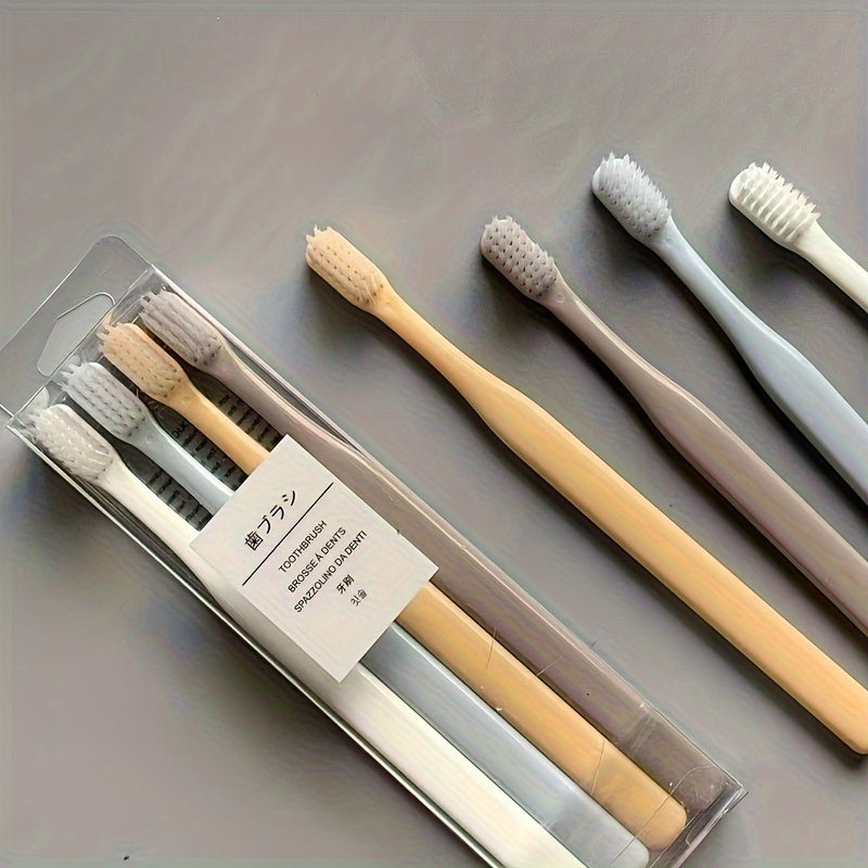 4 Macaron toothbrushes with soft bristles, bamboo charcoal handle, gentle on gums, deep cleaning dental care.