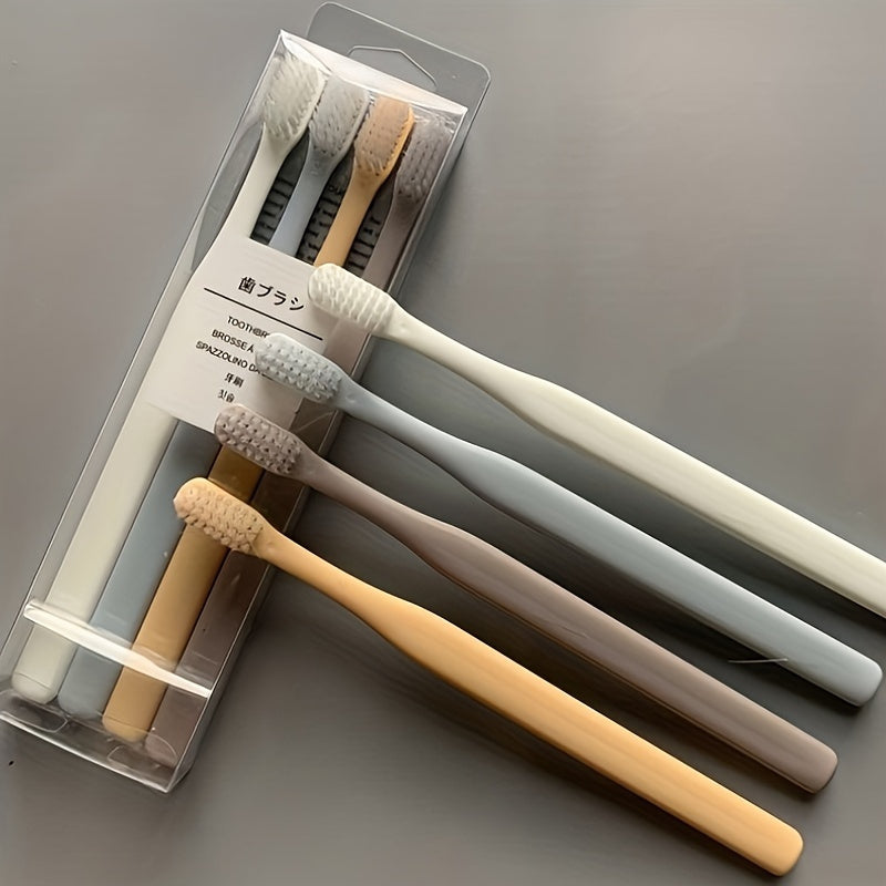 4 Macaron toothbrushes with soft bristles, bamboo charcoal handle, gentle on gums, deep cleaning dental care.