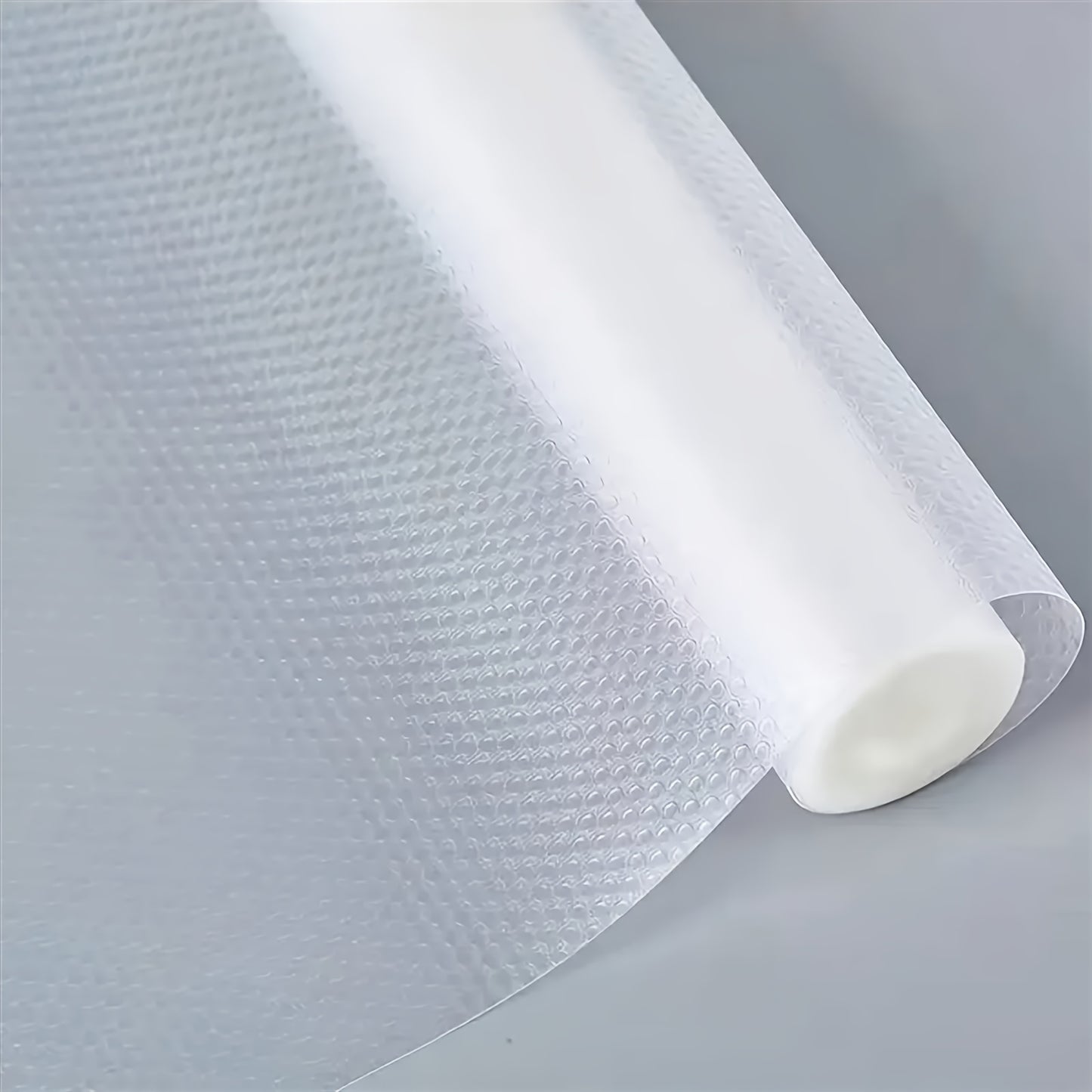 1 Roll of non-adhesive waterproof shelf liners for kitchen cabinets, shelves, and desks.