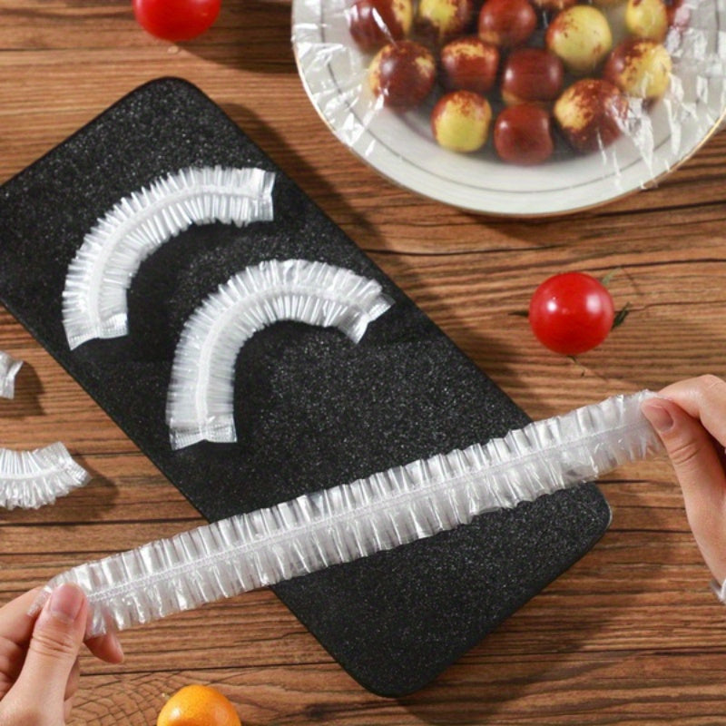 100 pieces of disposable food covers with elastic, plastic bowl caps that are reusable in the kitchen and refrigerator. These dustproof food storage covers are perfect for protecting leftovers, fruits, and essential for outdoor picnics.