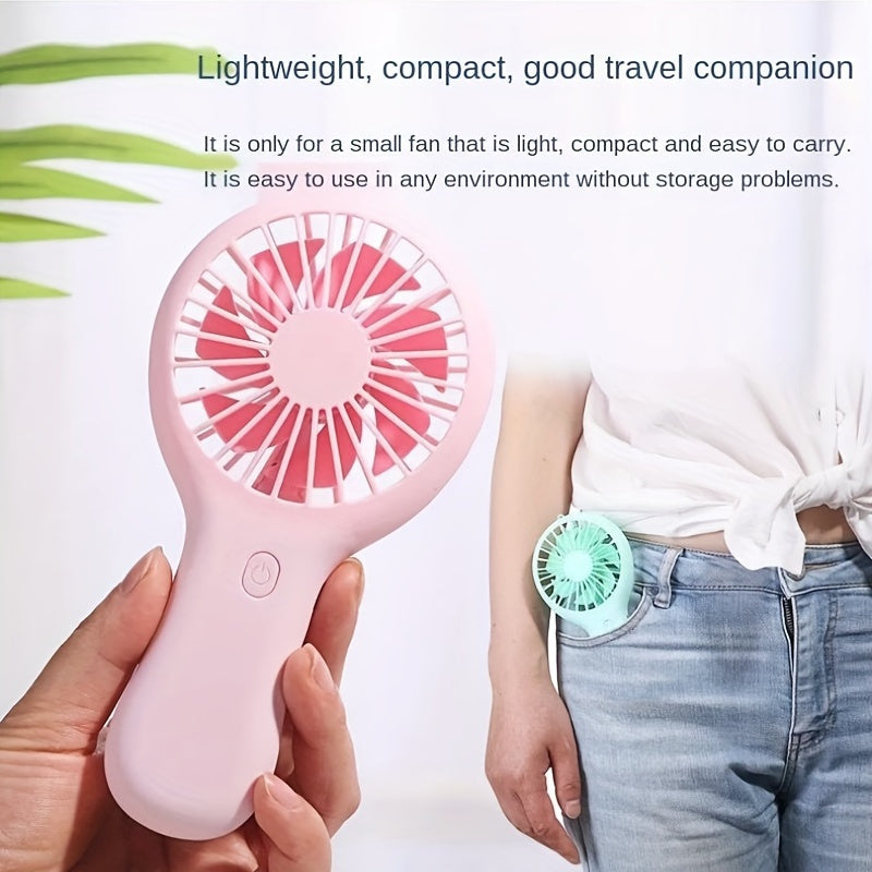 Compact and wearable mini fan for travel, office, outdoor, and home use. This handheld fan is portable, USB rechargeable, and includes a 400mAh lithium battery.