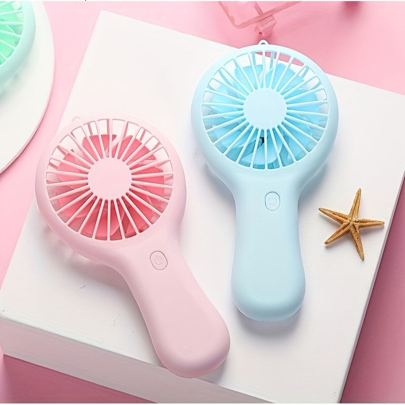 Compact and wearable mini fan for travel, office, outdoor, and home use. This handheld fan is portable, USB rechargeable, and includes a 400mAh lithium battery.