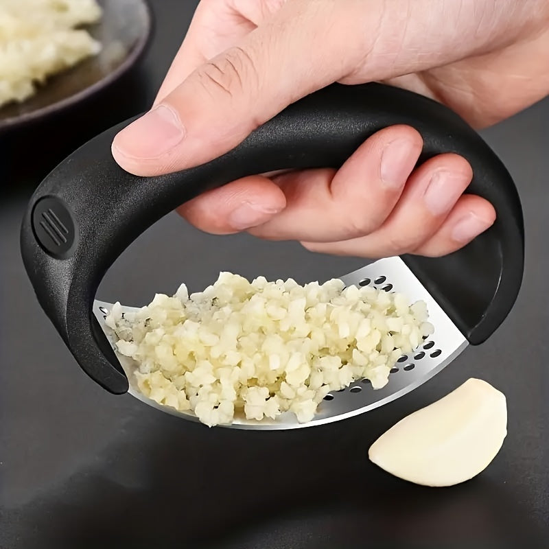 Efficient and ergonomic stainless steel garlic press for easy food prep.