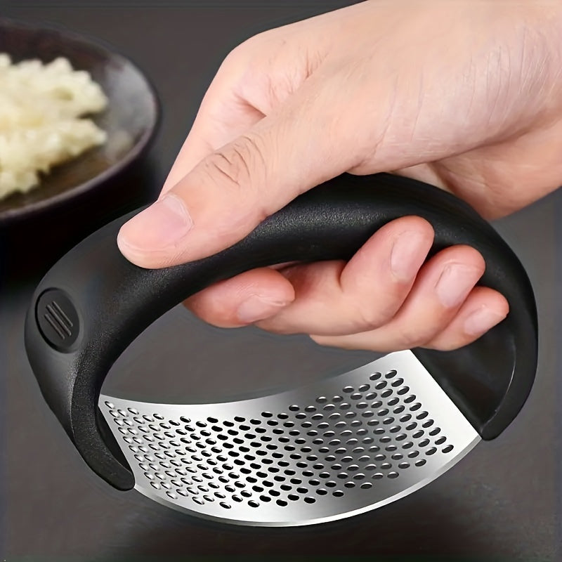 Efficient and ergonomic stainless steel garlic press for easy food prep.