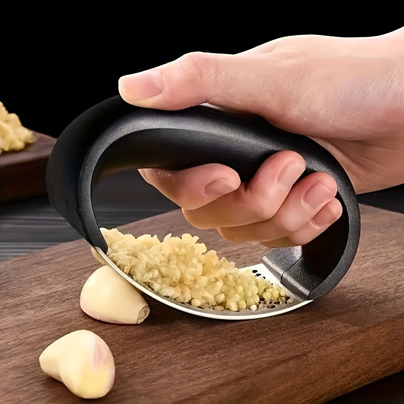 Efficient and ergonomic stainless steel garlic press for easy food prep.