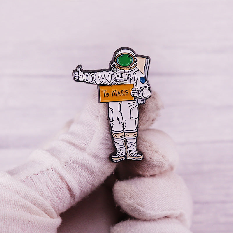 One adorable enamel pin featuring an astronaut design, made from alloy material. Perfect for adding a touch of space-themed flair to clothing or backpacks. A must-have for any Mars enthusiast!