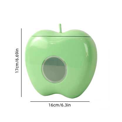 Apple-shaped wall-mounted storage organizer for plastic wrap and food covers. Unique closure, non-waterproof.