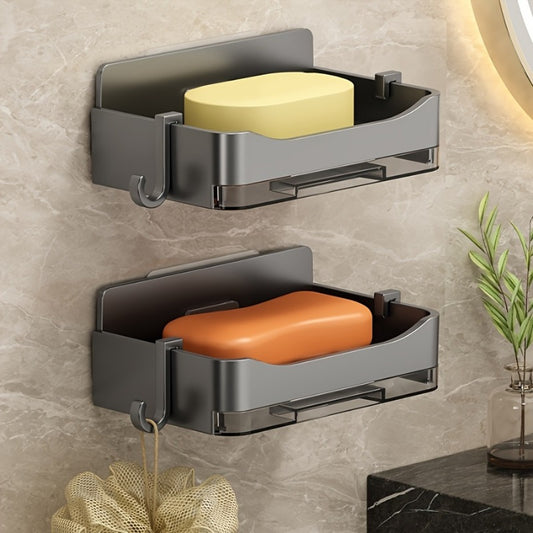 Wall-mounted soap holder with draining soap tray for bathroom storage.