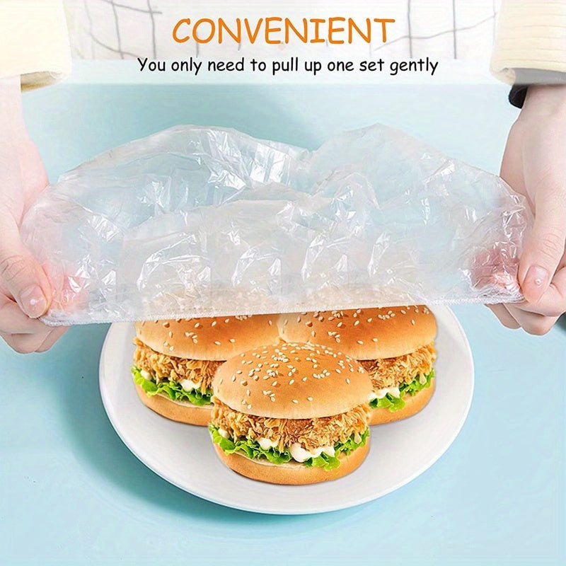 100 pieces of disposable food covers made of plastic wrap with elastic bands - ideal for covering fruits, bowls, and cups to keep them fresh in the kitchen.