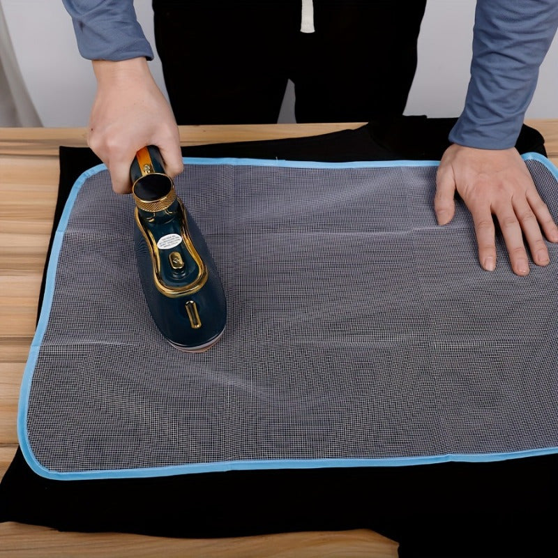 Heat-resistant ironing mat with protective mesh cloth for clothes and ironing board protection. This non-electric steam iron pad is designed to keep your ironing surface safe and damage-free.