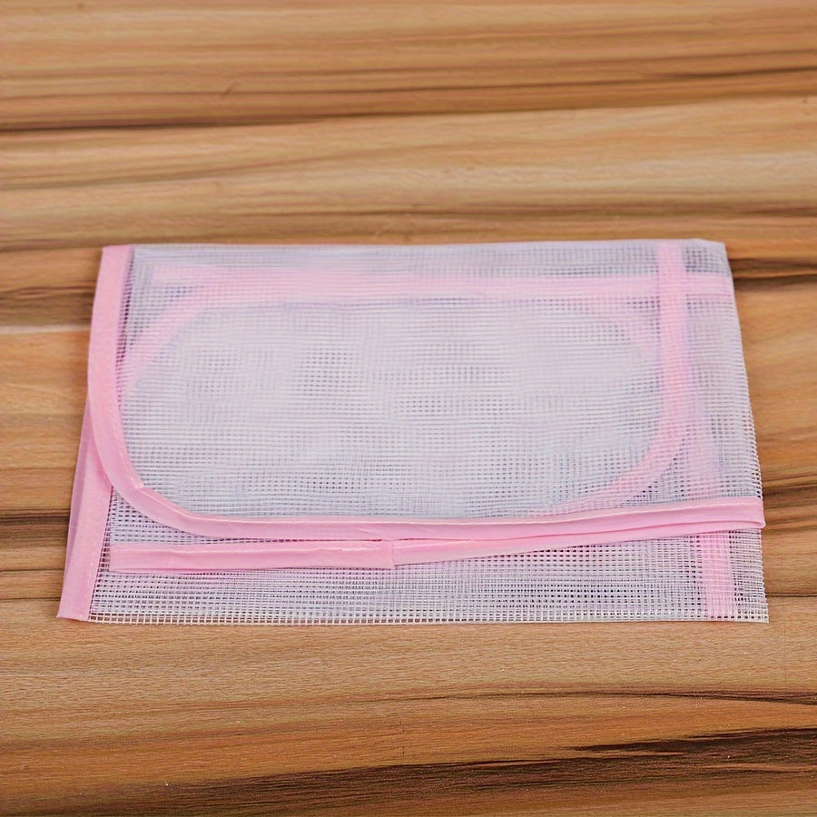 Heat-resistant ironing mat with protective mesh cloth for clothes and ironing board protection. This non-electric steam iron pad is designed to keep your ironing surface safe and damage-free.