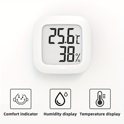 Small white LCD digital thermometer hygrometer with battery, accurate temperature and humidity monitor for home. Features include a joyful face indicator, mini design, and humidity control. Powered by batteries.