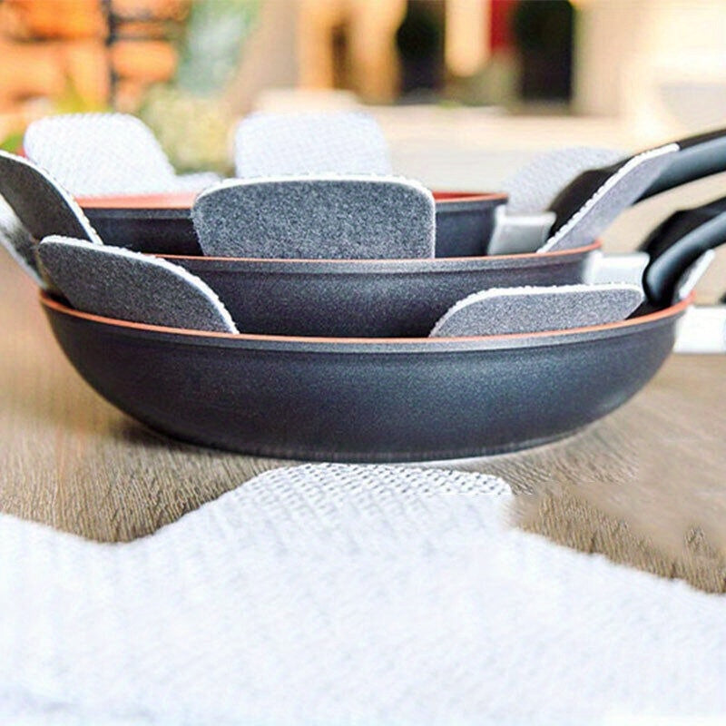 12 pieces of gray felt pad protectors for home use to prevent scratching and sticking on cookware, pots, pans, and utensils. A must-have accessory for your kitchen.