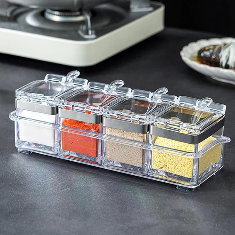 Organize your spices with ease using this 4-in-1 set of clear acrylic spice organizers. Each container comes with a lid and serving spoon, making it perfect for storing salt, sugar, and other seasonings. This space-saving kitchen storage solution will