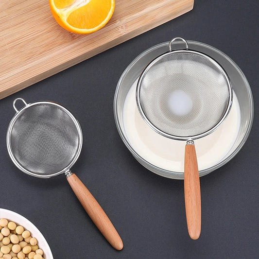 This versatile kitchen colander features a durable stainless steel mesh strainer and a convenient wooden handle. Ideal for straining tea, juice, flour, and cooking tasks, this food-safe tool is perfect for all your kitchen needs.