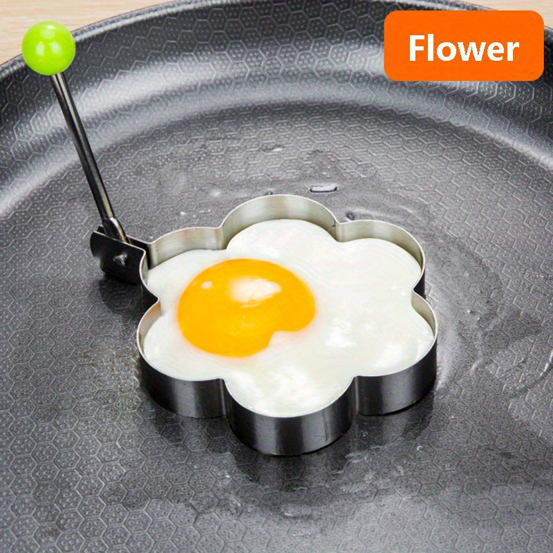 Set of 4 stainless steel egg molds for shaping breakfast at home. Includes heart, star, flower, and round shapes.