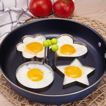 Set of 4 stainless steel egg molds for shaping breakfast at home. Includes heart, star, flower, and round shapes.