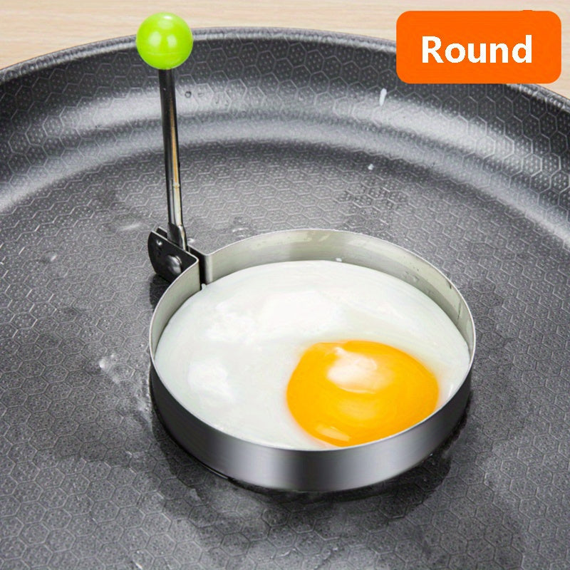 Set of 4 stainless steel egg molds for shaping breakfast at home. Includes heart, star, flower, and round shapes.