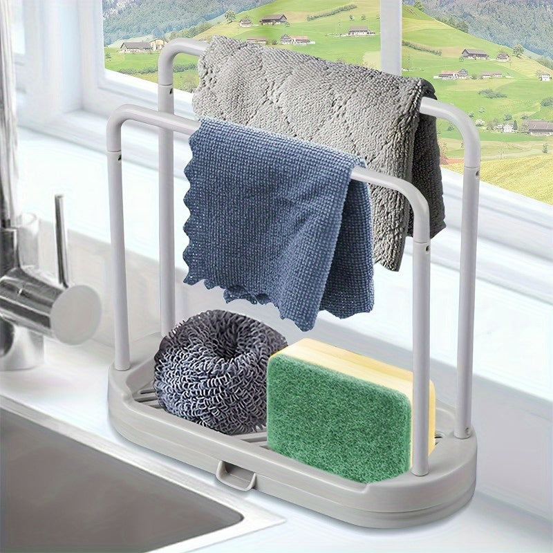 Space-saving kitchen organizer with quick-dry sponge and cloth stand, made of durable plastic. Perfect for keeping countertops organized and neat. Features a practical design for functionality.