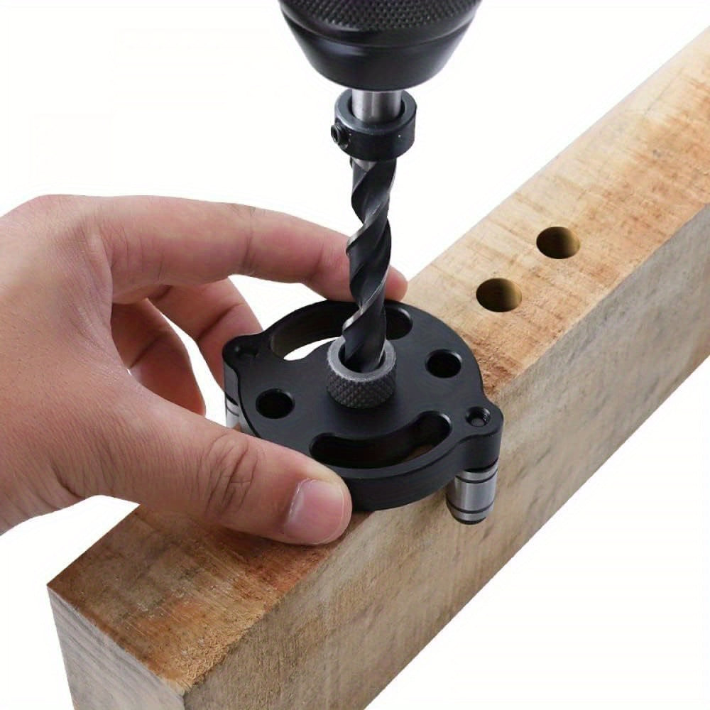 Self-centering doweling jig for straight holes in wood panels, handheld drill guide for woodworking joints.