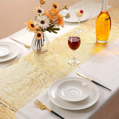 Golden polyester organza table runner with glitter accents, ideal for weddings, showers, and parties.