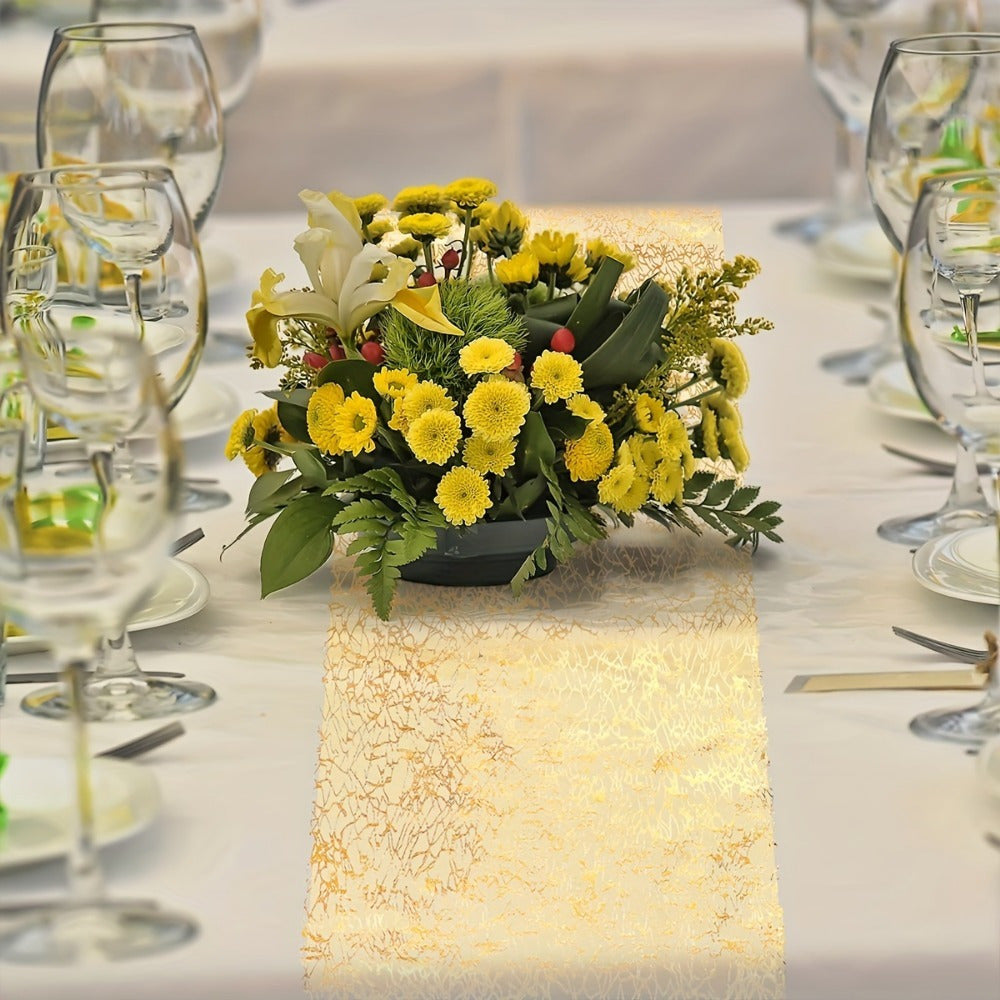 Golden polyester organza table runner with glitter accents, ideal for weddings, showers, and parties.