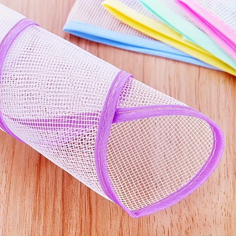 Heat-resistant mesh pad protects clothes during ironing; no need for electricity; color varies.