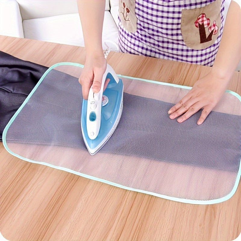 Heat-resistant mesh pad protects clothes during ironing; no need for electricity; color varies.