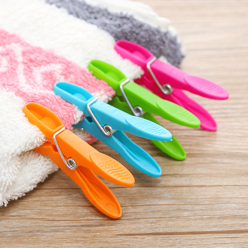 Durable Grip Clothes Pegs for Home and Kitchen Use - Set of 24 Multi-Purpose Plastic Laundry Clips for Towels, Socks, and Bed Sheets.