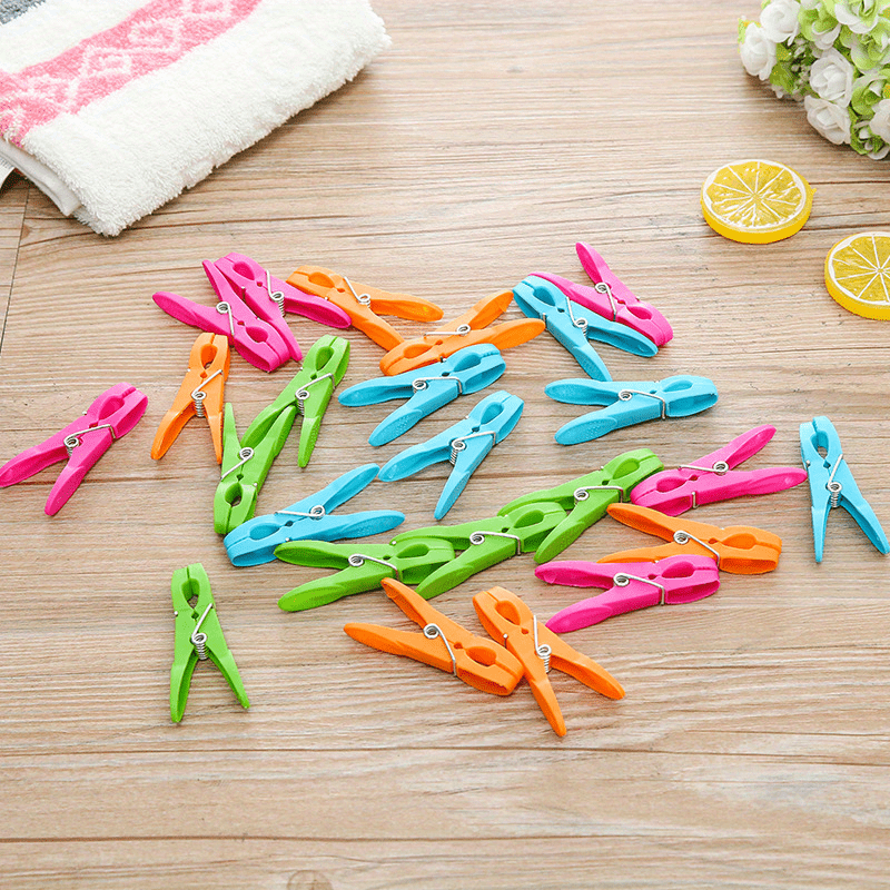 Durable Grip Clothes Pegs for Home and Kitchen Use - Set of 24 Multi-Purpose Plastic Laundry Clips for Towels, Socks, and Bed Sheets.