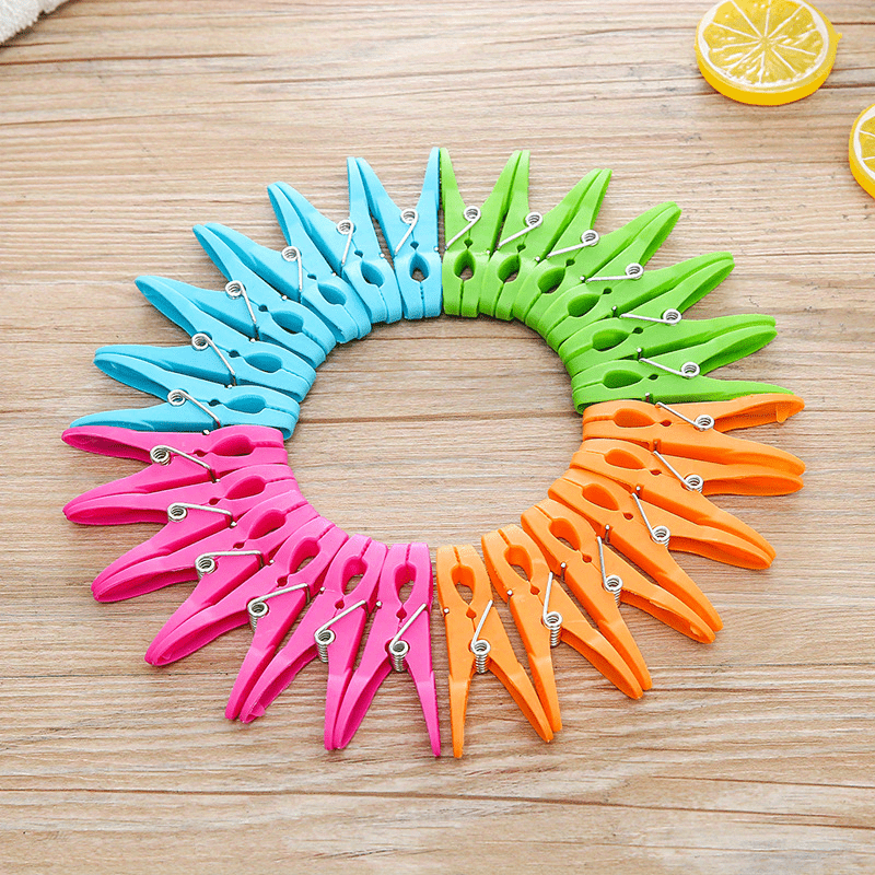 Durable Grip Clothes Pegs for Home and Kitchen Use - Set of 24 Multi-Purpose Plastic Laundry Clips for Towels, Socks, and Bed Sheets.