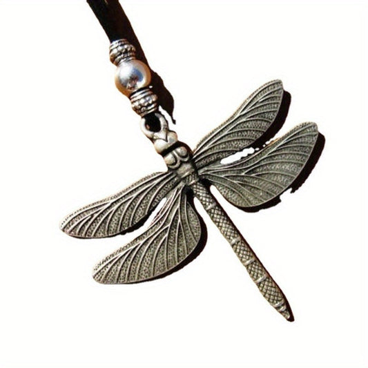 Vintage Tribal Dragonfly Pendant Necklace made from alloy with a leather cord. This ethnic necklace features a long rope chain, perfect for daily wear or to add a touch of style to your vacation outfit.