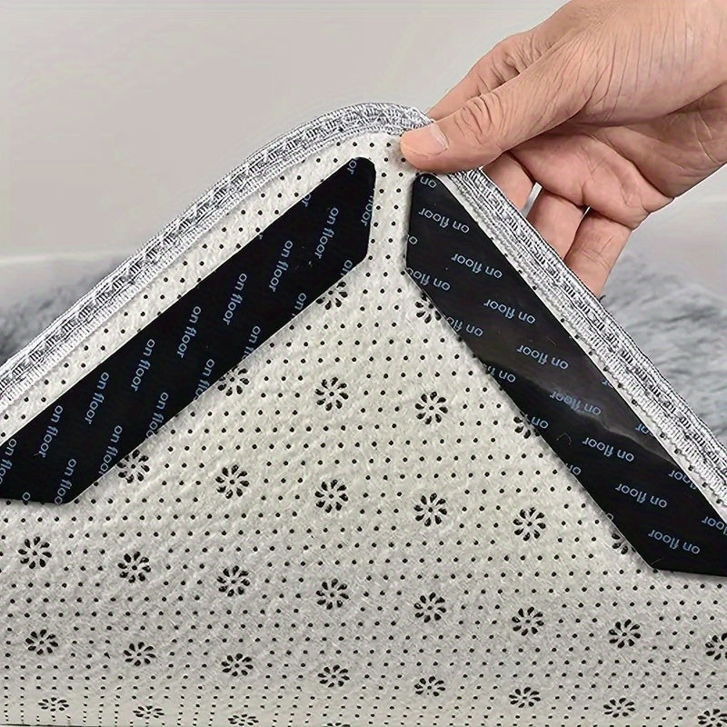 Prevent rugs from slipping and sliding with our GripMax Non-Slip Rug Grippers! This pack includes 16 pieces, perfect for securing the edges of your carpets in the living room, bedroom, bathroom, or any indoor space. Made of durable black plastic, these