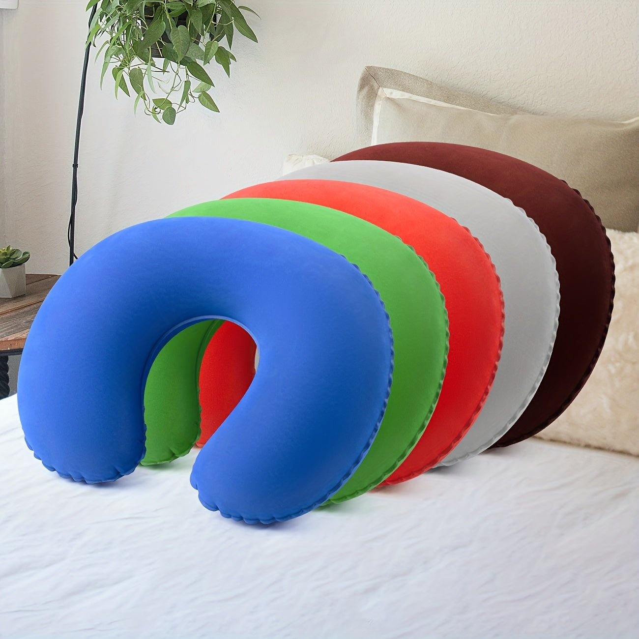 Travel in comfort with the Ultra-Comfort Inflatable U-Shaped Travel Pillow, providing neck support for car and airplane journeys. The pillow features a soft PVC flocking cover that is hand washable for easy maintenance.