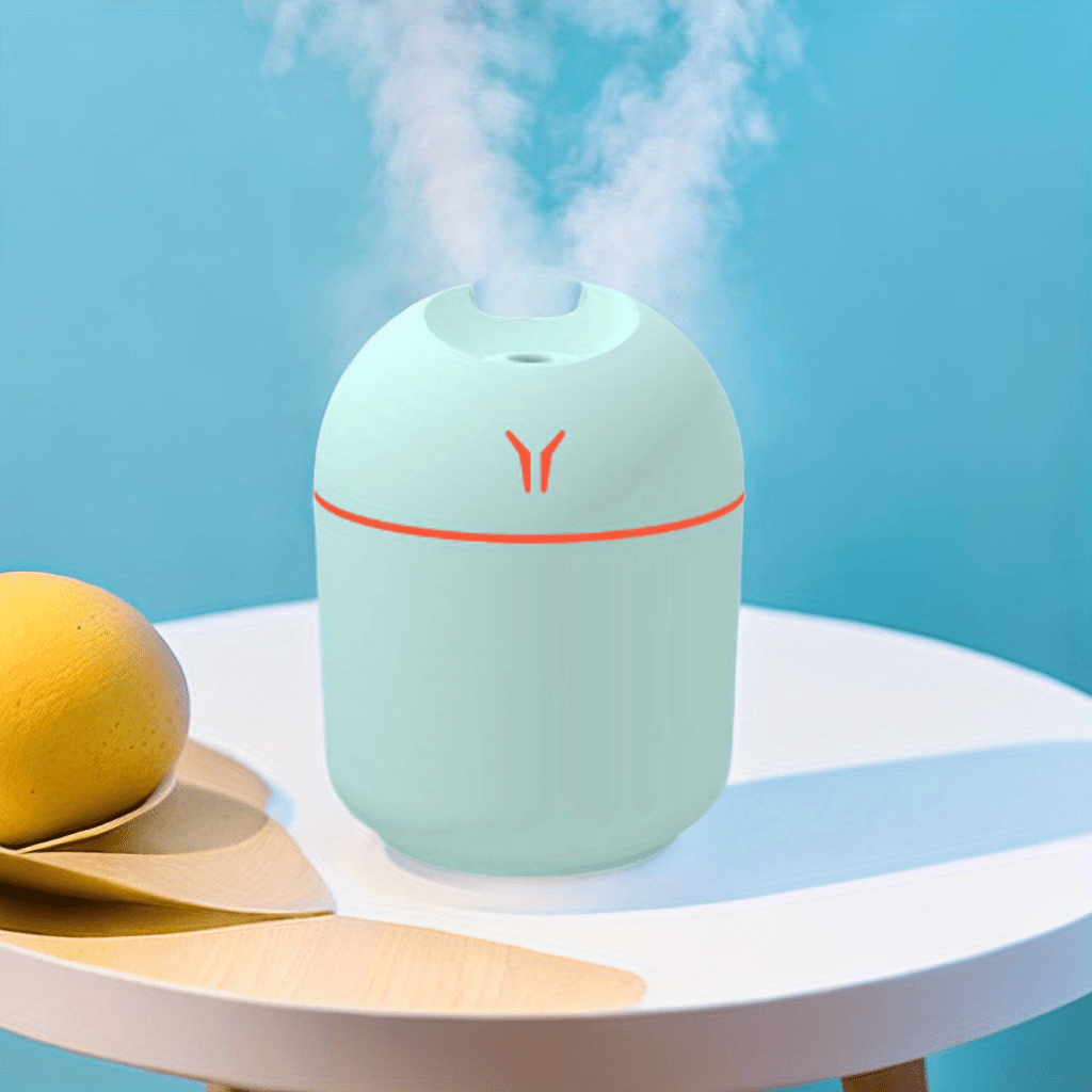 USB Mini Air Humidifier: Aroma Diffuser for Home & Car - Silent Mist Maker with LED Light.